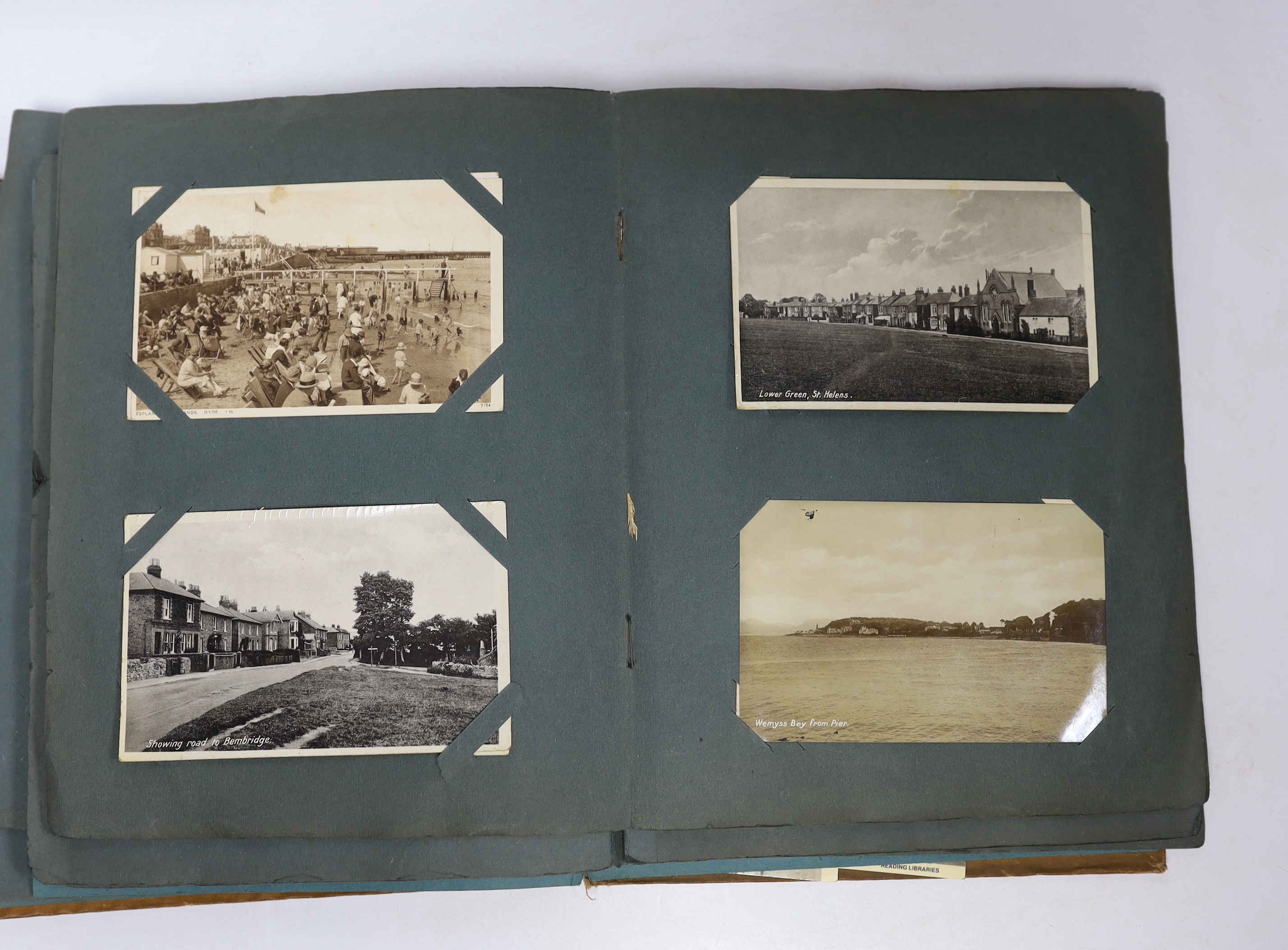 A postcard album and various early 20th century postcards, of various views of UK towns, etc.